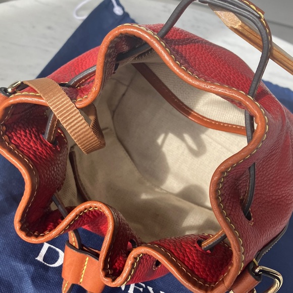 Dooney & Bourke red pebble grain leather small drawstring crossbody purse. - Picture 4 of 5